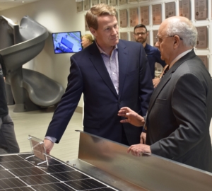 Roll-A-Rack founder Roll-A-Rack founder Don Scipione (right) demonstrates the wide-scale economic advantages of his new solar-installation approach to Ohio Lt. Gov. Jon Husted (left) Monday, when Husted visited Cleveland to review innovative new companies. (right) demonstrates the wide-scale economic advantages of his new solar-installation approach to Ohio Lt. Gov. Jon Husted (left) Monday, when Husted visited Cleveland to review innovative new companies.